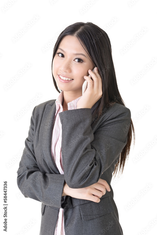 Asian businesswoman speaking on the cell phone Asian businesswoman speaking on the cell phone
