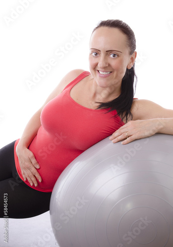smiling attractive woman on excersise ball © djtaylor