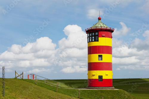 Historical Lighthouse at the North Sea in Germany`s Pilsum.