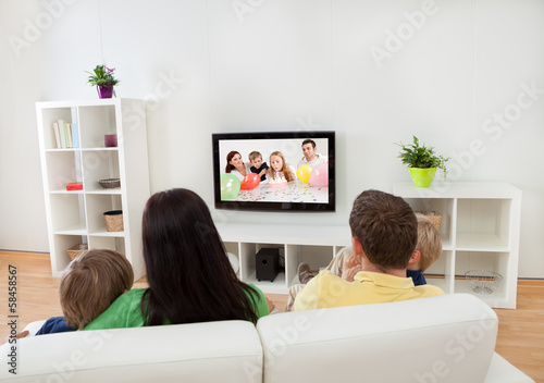 Young family watching TV