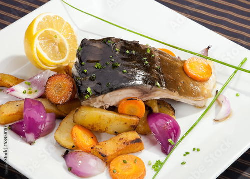 Grilled carp with vegetable garnish