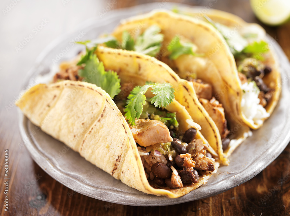 authentic mexican tacos in yellow corn shell with chicken authentic mexican tacos in yellow corn shell with chicken
