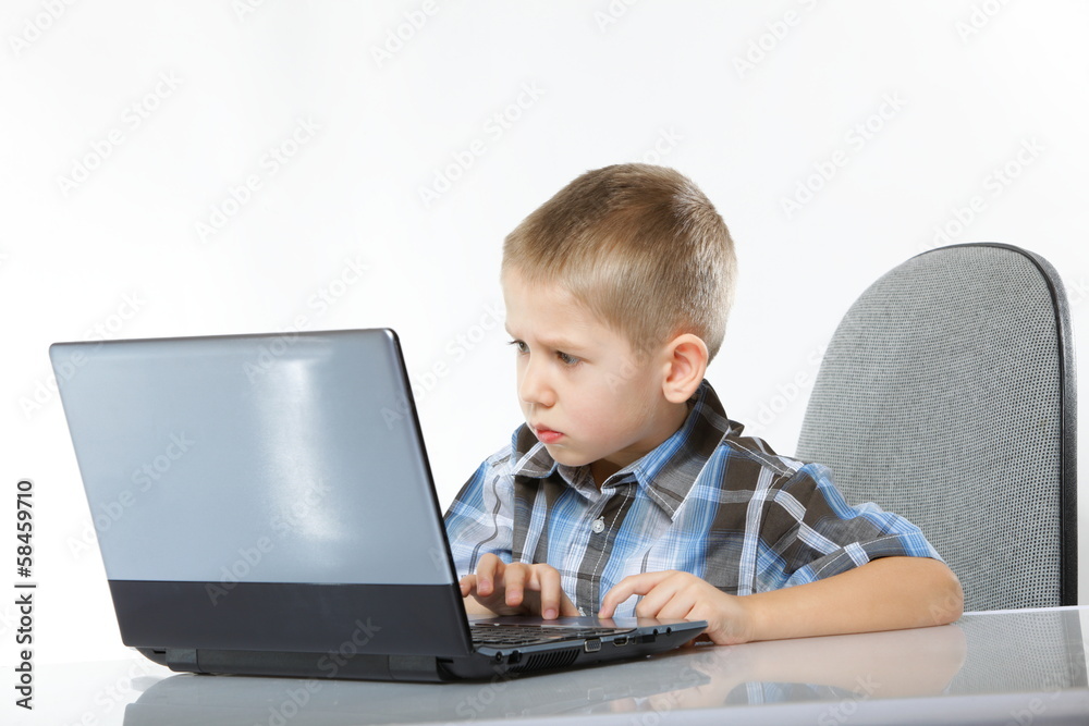 Computer addiction child with laptop notebook Computer addiction child with laptop notebook