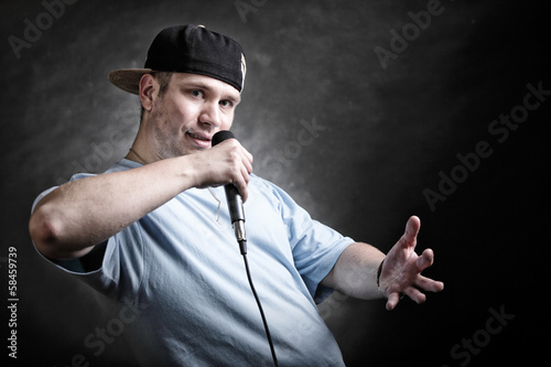 Rap singer man with microphone cool hand gesture