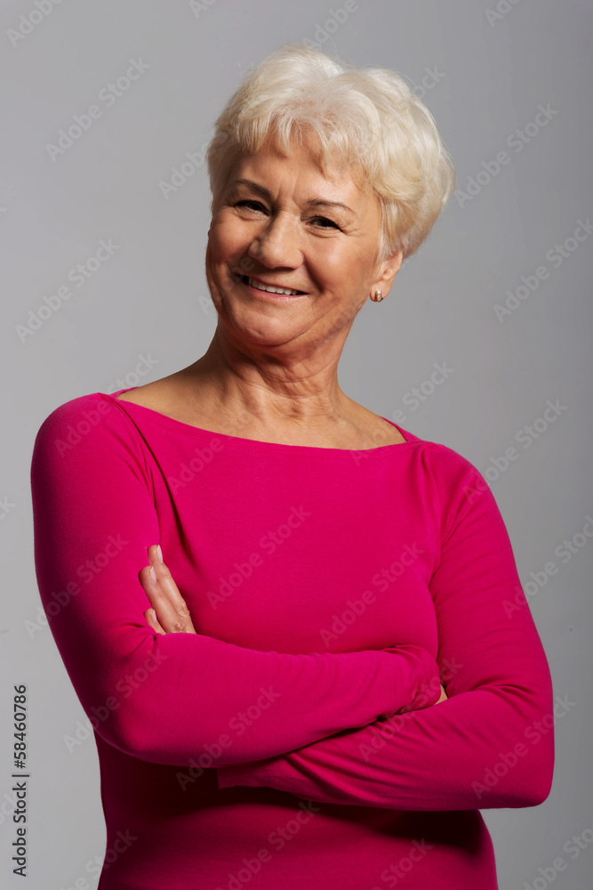 An old lady's portrait in pink casual clothes. An old lady's portrait in pink casual clothes.