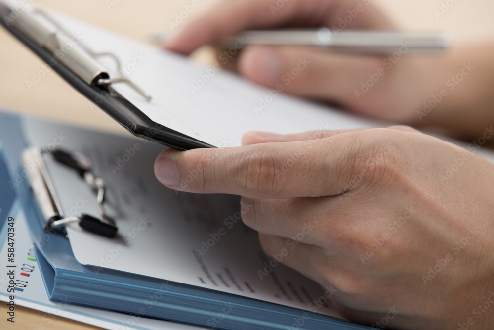 man hand with business report man hand with business report