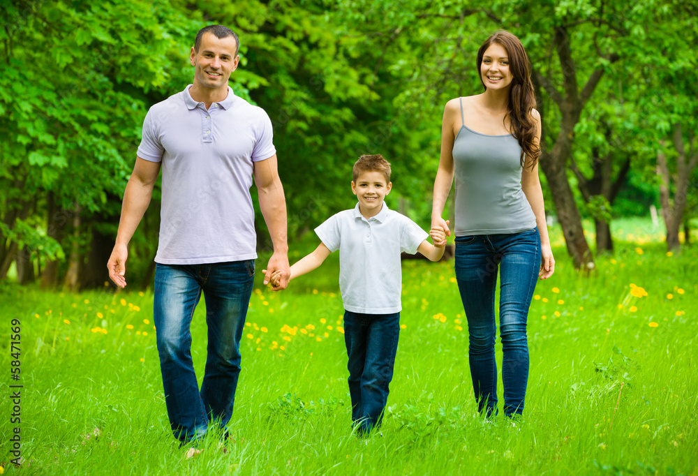 Full-length portrait of happy family of three Full-length portrait of happy family of three