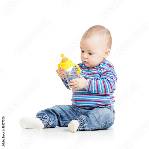 baby child drinking from bo...