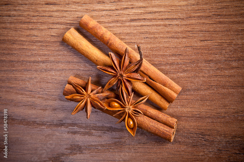 cinnamon sticks and star anise on a wooden background