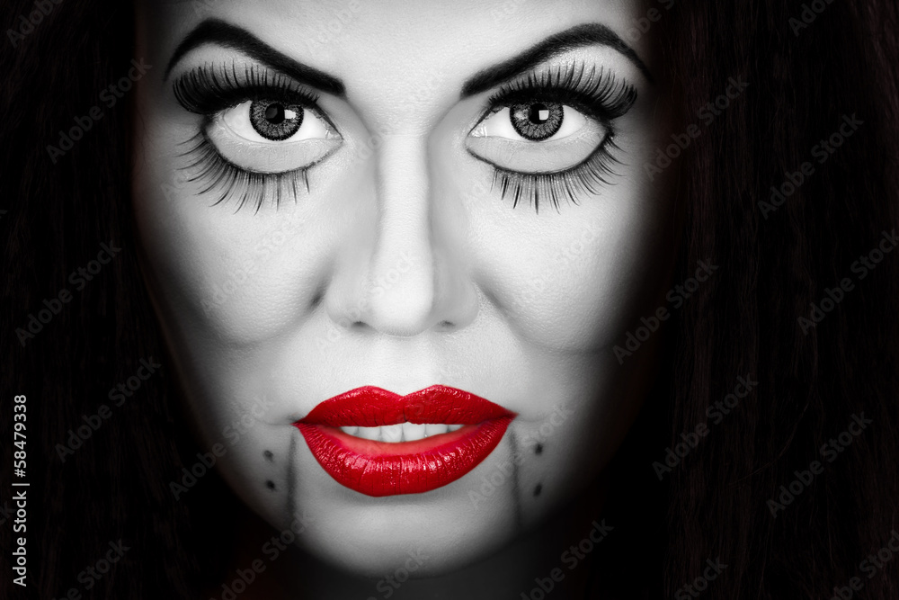 Woman face with creative make up and eyelashes Woman face with creative make up and eyelashes