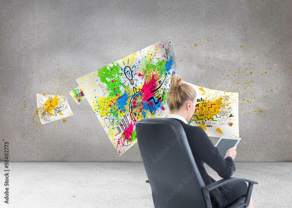 Composite image of businesswoman sitting on swivel chair with ta Composite image of businesswoman sitting on swivel chair with ta