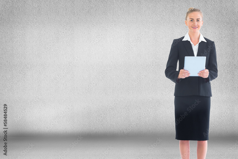 Composite image of businesswoman holding new tablet Composite image of businesswoman holding new tablet