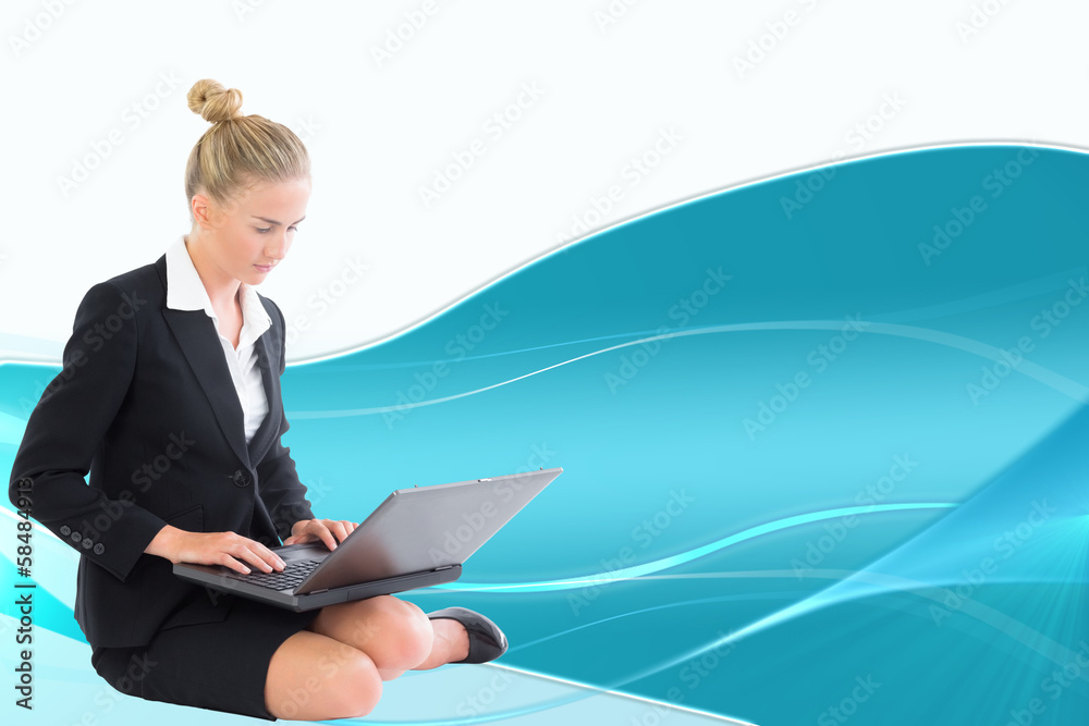 Composite image of businesswoman using laptop Composite image of businesswoman using laptop