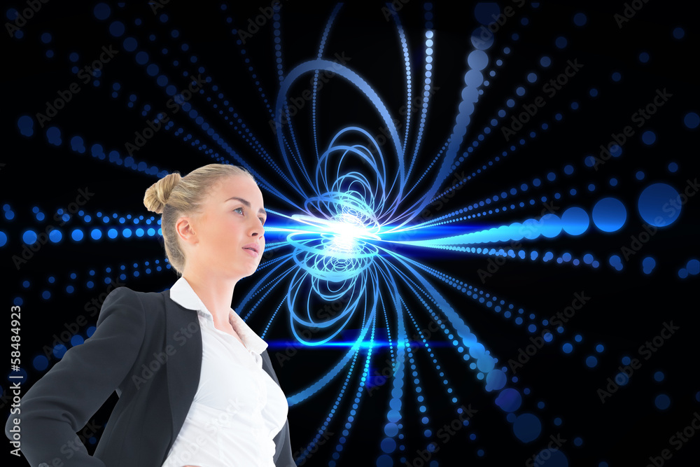 Composite image of businesswoman standing with hands on hips Composite image of businesswoman standing with hands on hips