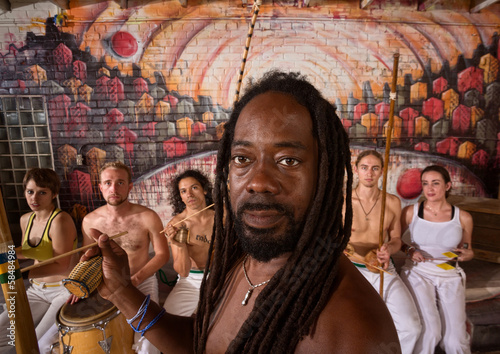 Handsome Capoeira Master with Instruments