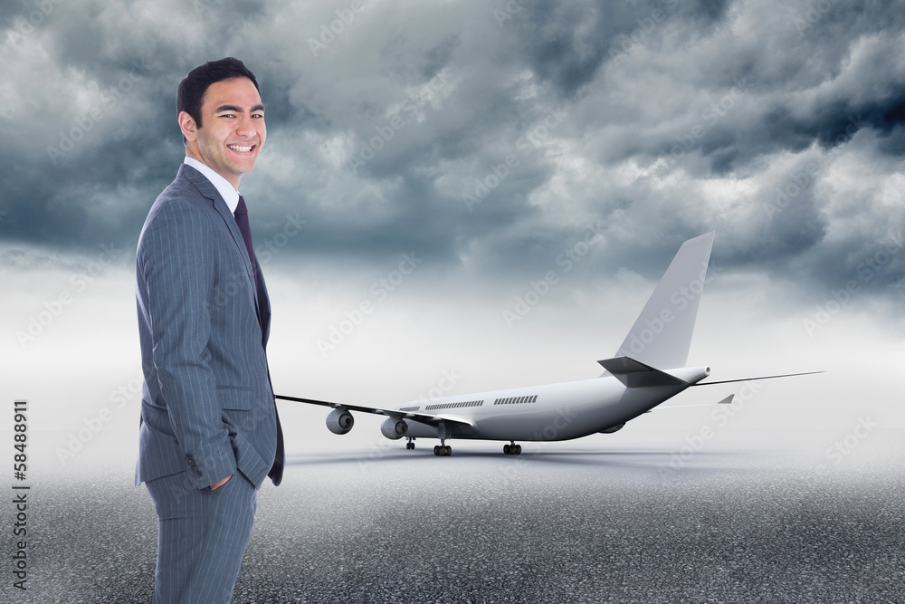 Obraz premium Composite image of smiling businessman standing