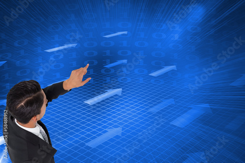 Composite image of asian businessman pointing