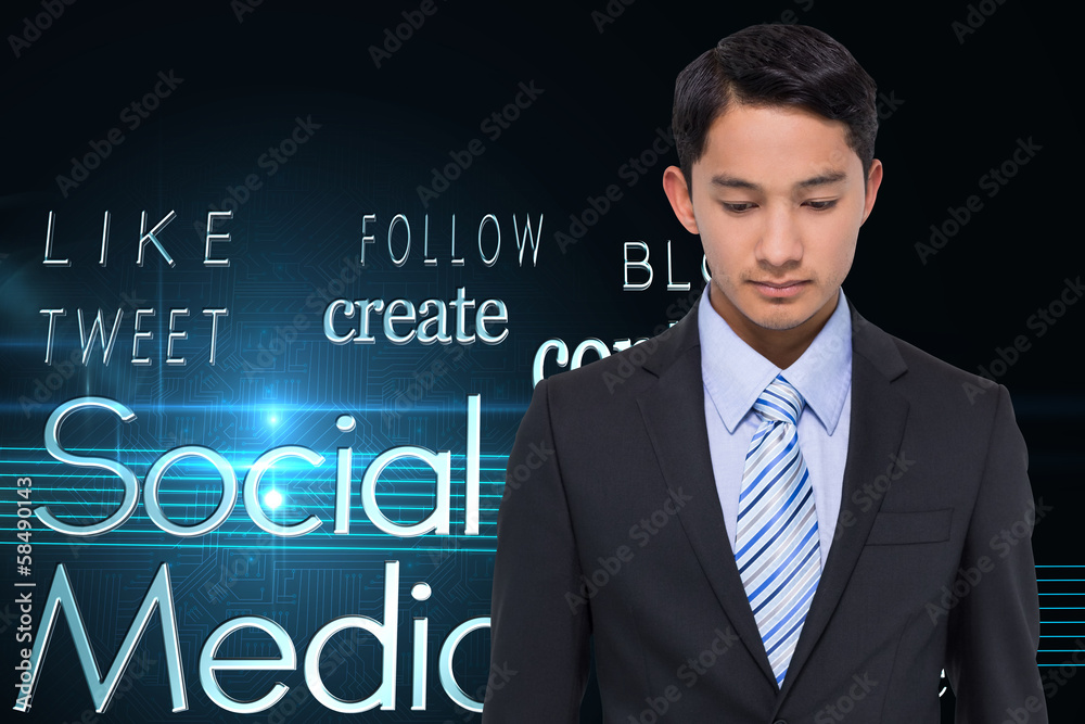 Composite image of serious asian businessman