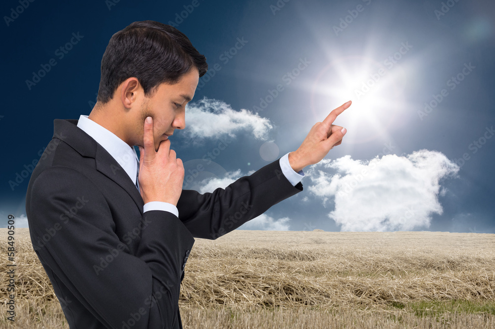 Composite image of thoughtful asian businessman pointing Composite image of thoughtful asian businessman pointing