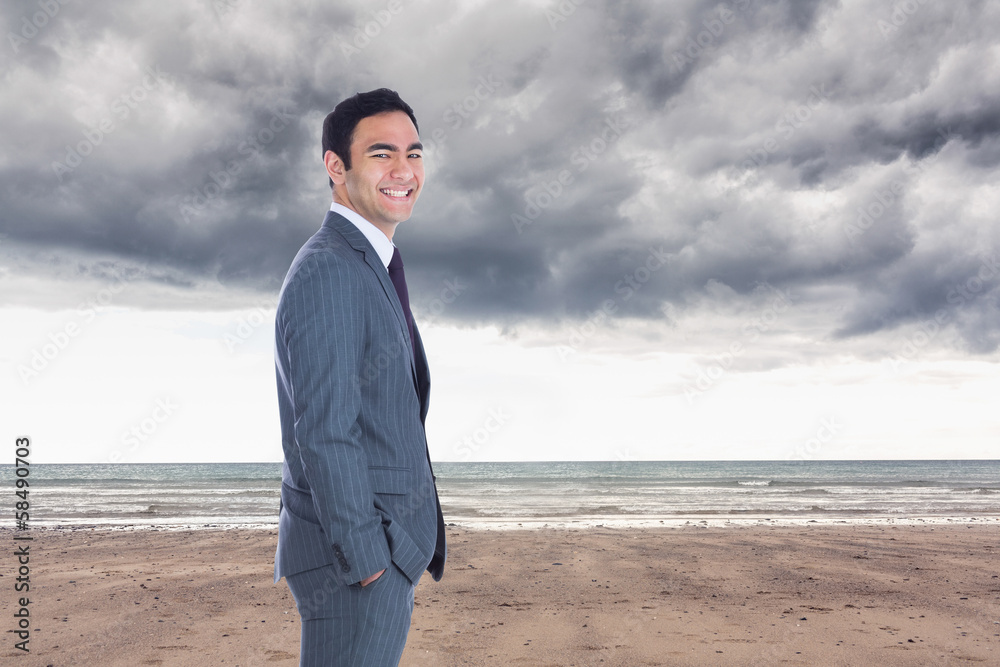 Composite image of smiling businessman standing Composite image of smiling businessman standing