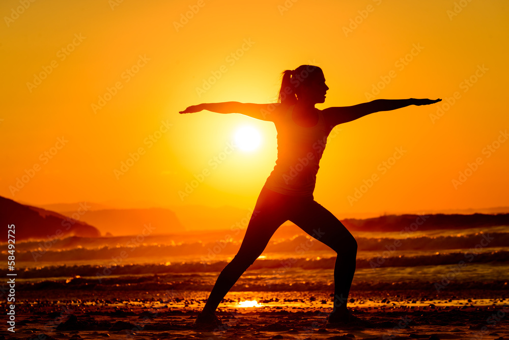 Yoga and relax on beach  at sunset
