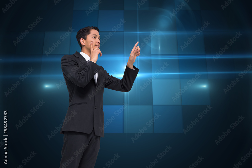 Composite image of thoughtful asian businessman pointing Composite image of thoughtful asian businessman pointing