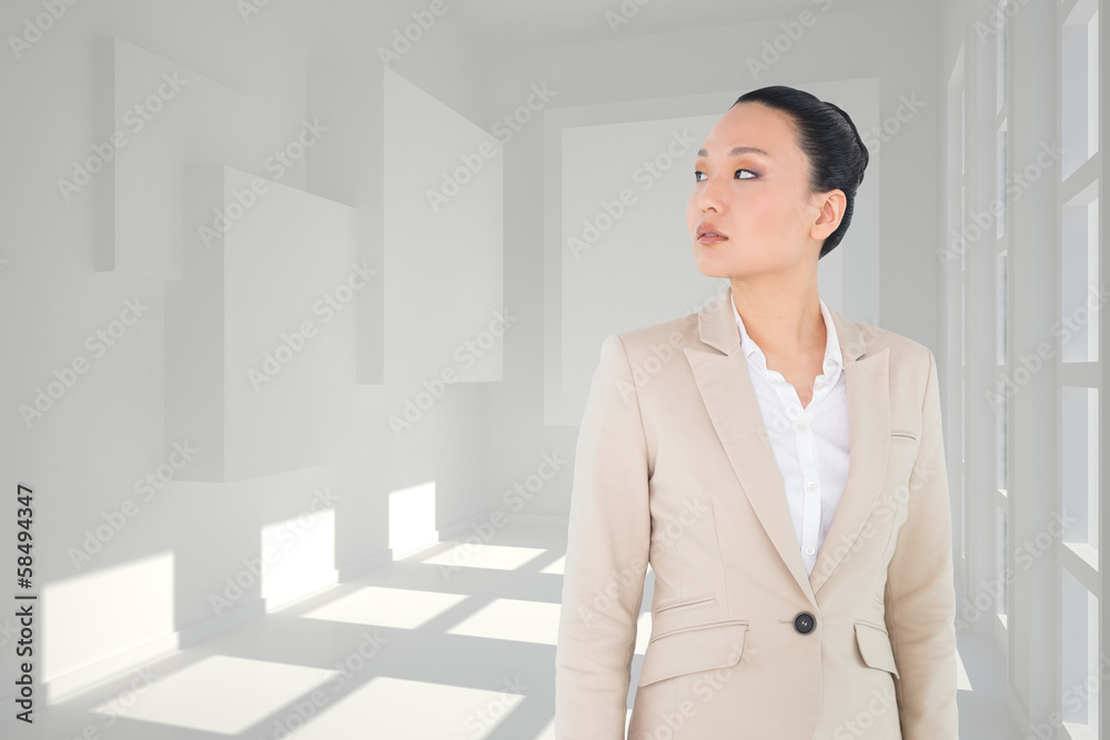 Composite image of unsmiling asian businesswoman Composite image of unsmiling asian businesswoman