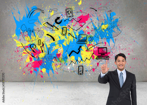 Composite image of smiling asian businessman pointing