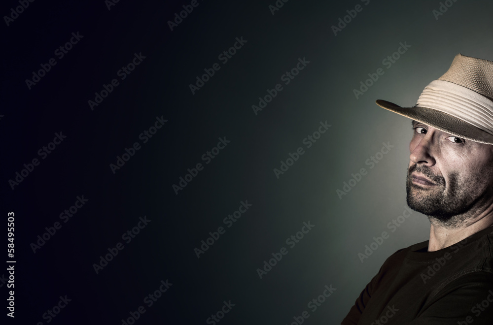 Portrait of a resolute man wearing a panama hat Portrait of a resolute man wearing a panama hat