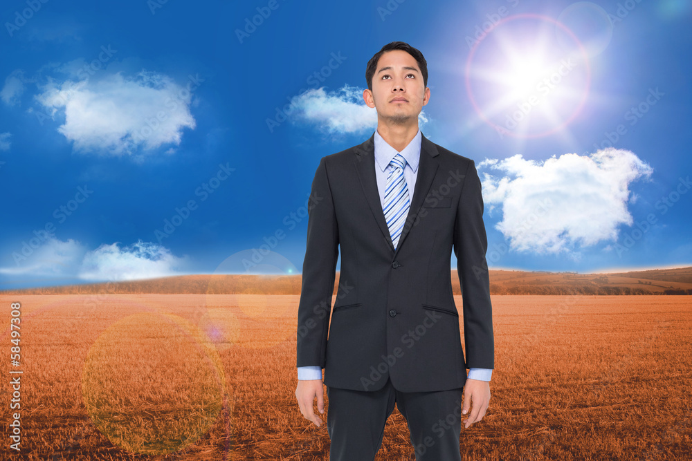 Composite image of serious asian businessman Composite image of serious asian businessman
