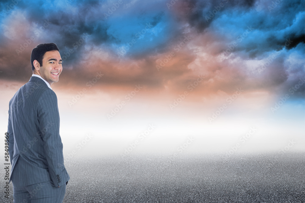 Composite image of smiling businessman standing Composite image of smiling businessman standing
