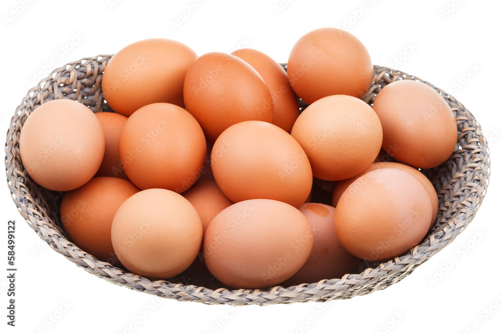 many fresh chicken eggs in wicker basket many fresh chicken eggs in wicker basket