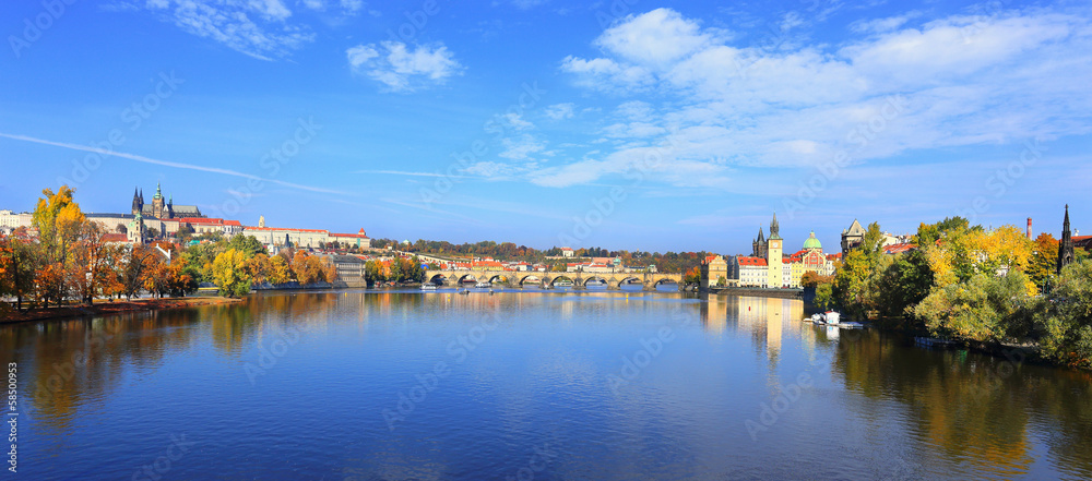 Fototapeta premium Panoramic autumn Prague with gothic Castle and Charles Bridge