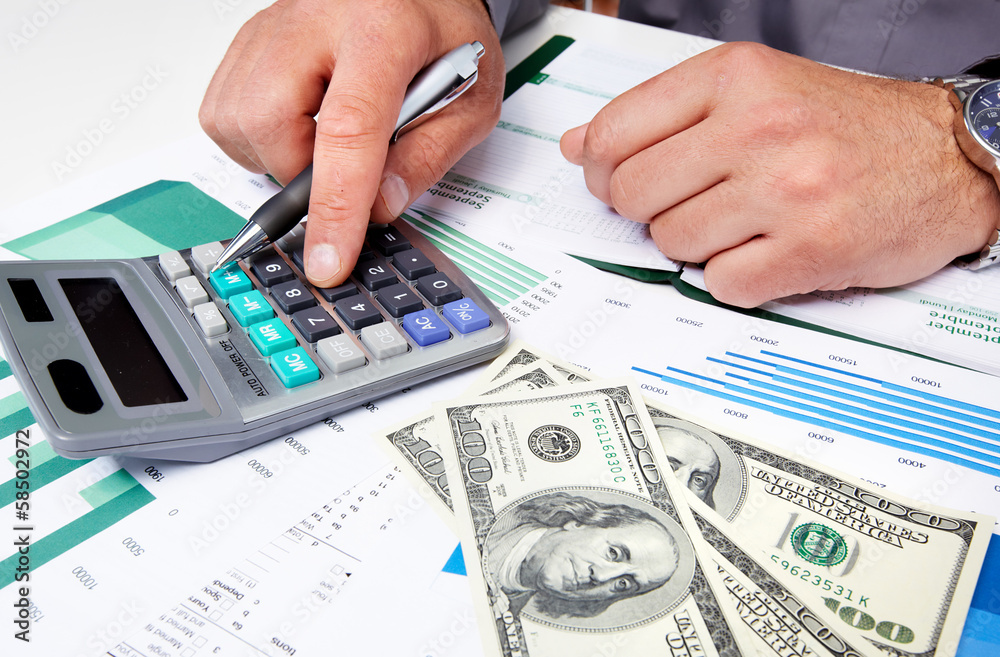 Hands of businessman with calculator. Hands of businessman with calculator.