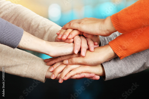 Human hands on bright background