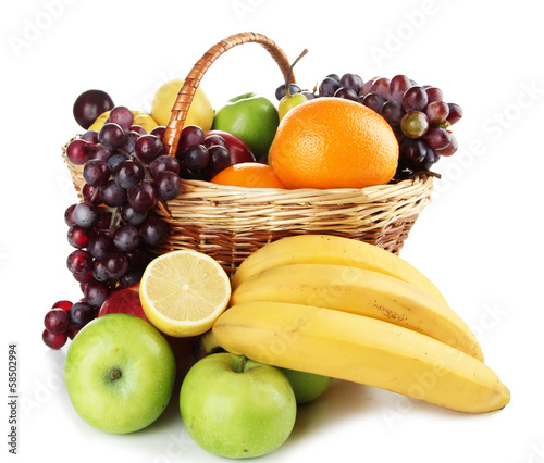 Composition of different fruits with basket isolated on white