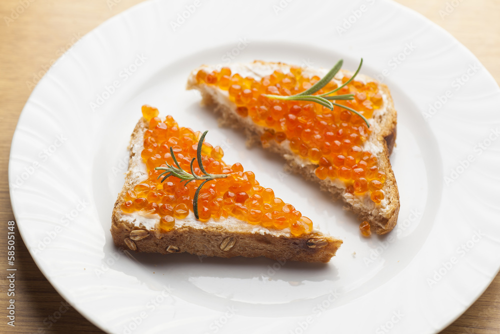 Sendwich with Caviar on bread decorated with rosemery Sendwich with Caviar on bread decorated with rosemery