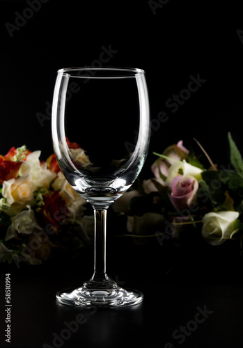 empty wine glass and roses