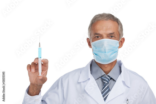 Experienced doctor is doing vaccination.