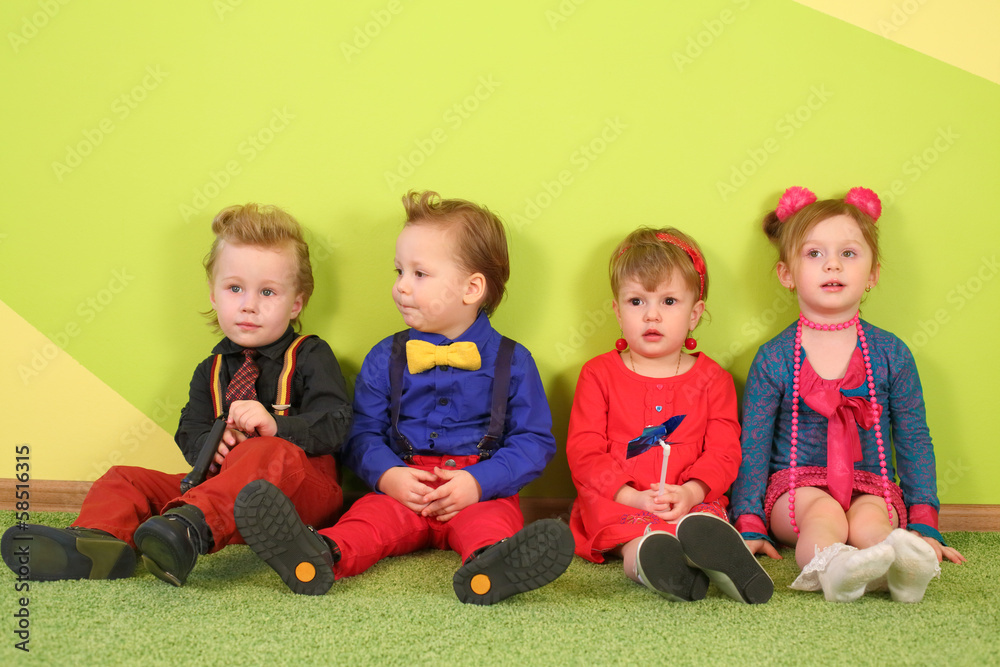 Two boys and two girls in bright clothes Two boys and two girls in bright clothes