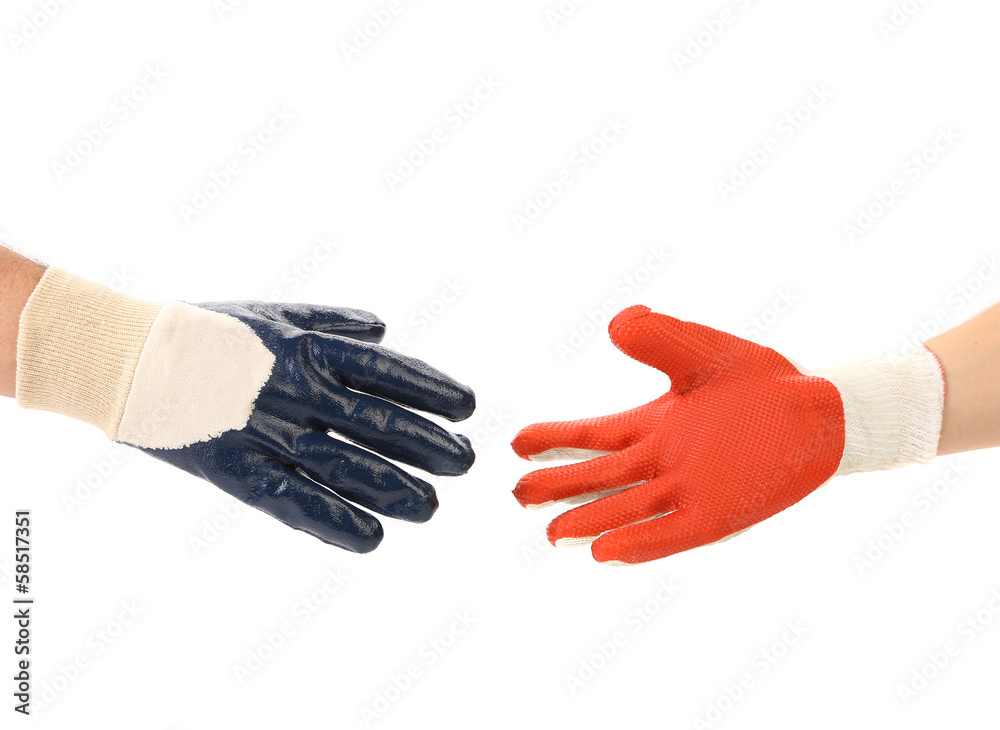 Two hands in gloves meet of hand shake Two hands in gloves meet of hand shake