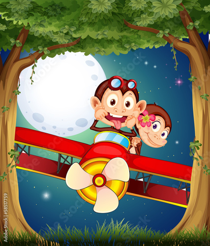 A forest with monkeys riding on a plane
