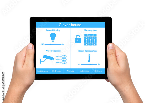 isolated men hands hold a tablet with system clever house on the