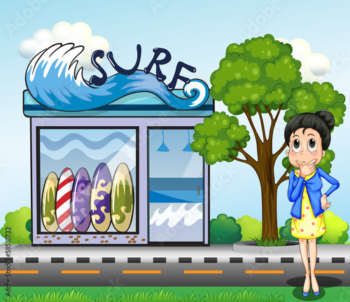 A woman thinking in front of the surfing shop