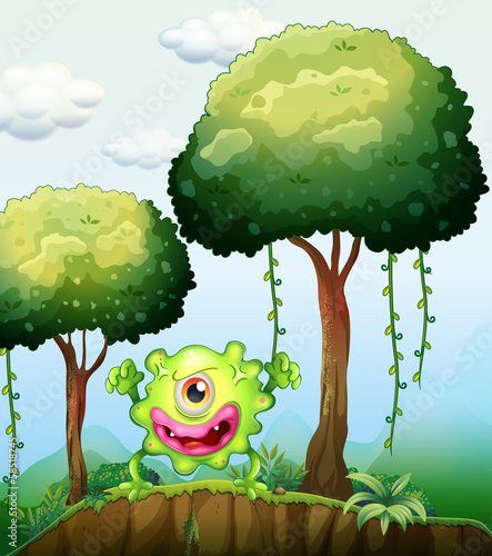 A playful green monster at the cliff in the forest