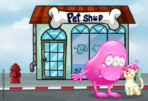 A pink beanie monster and a pet in front of the pet shop