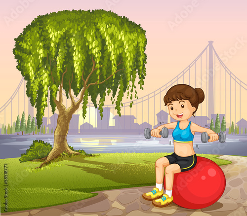 A lady near the old tree exercising