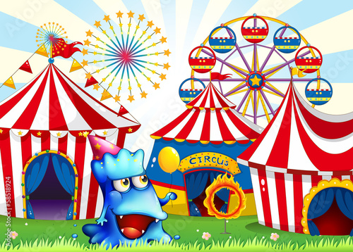 A blue monster near the circus tents
