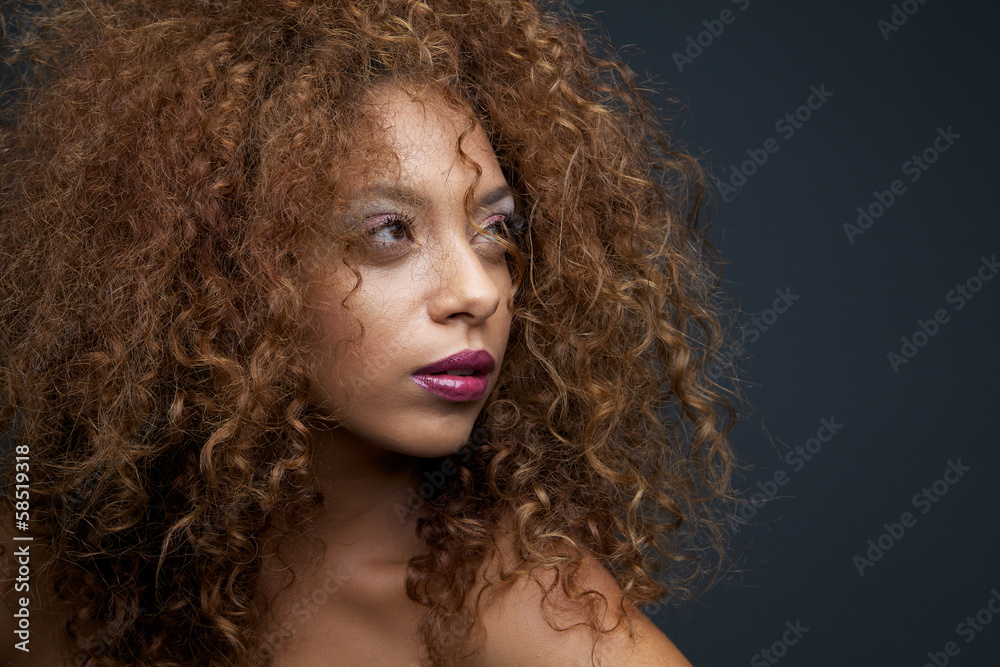 Gorgeous female fashion  model with curly hair
