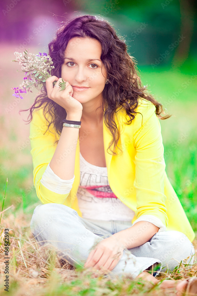 Girl on the grass with the flowers Girl on the grass with the flowers